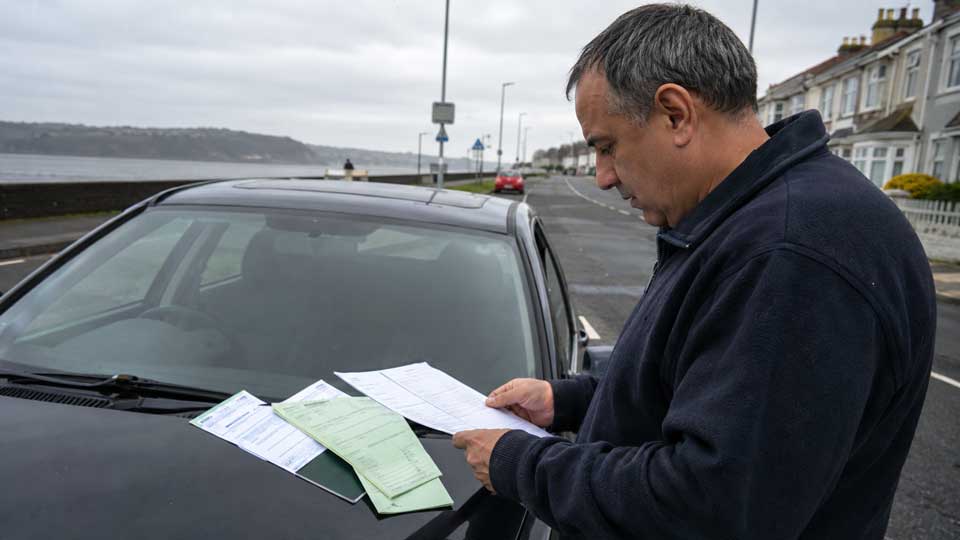 Illustration for: Do I need a green card to drive my own car in Britain?